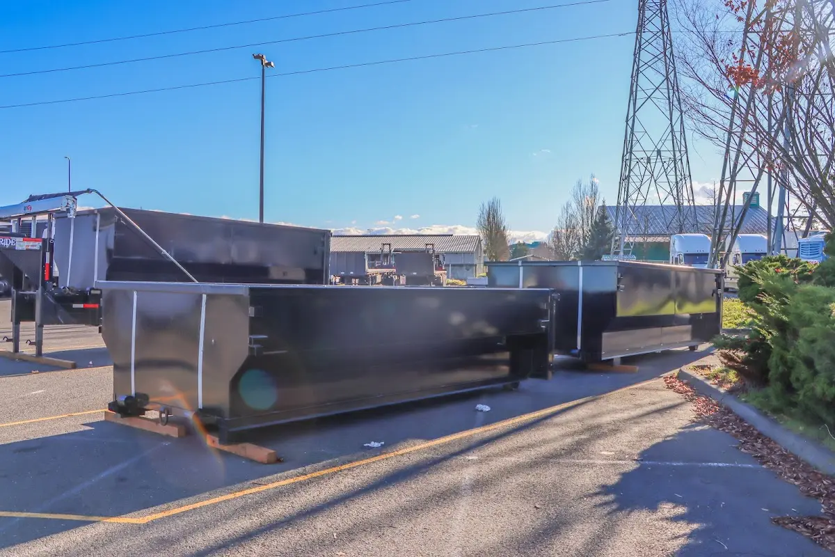 Roll-off dumpster ready for waste disposal at job site for Concrete Dumpster Rental in Greene